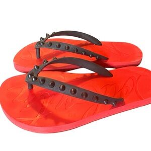 Christan Louboutin - Loubi Flip Spiked Rubber Flip Flops
Size36